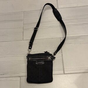 Coach Penelope Black Crossbody Bag with Adjustable Shoulder Strap Purple Lining